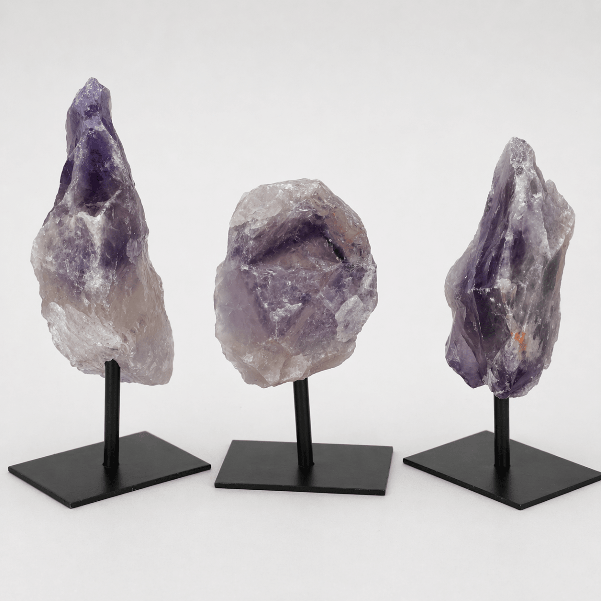 Rough amethyst specimen on a small metal stand, a crystal gift under $25