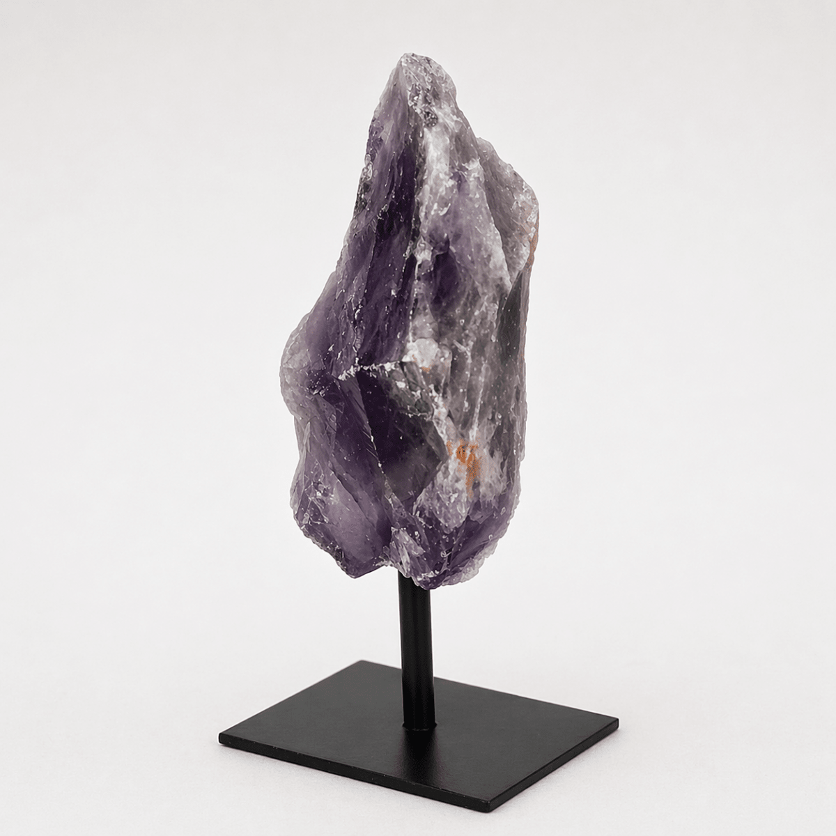 Rough amethyst specimen on a metal stand, view 3
