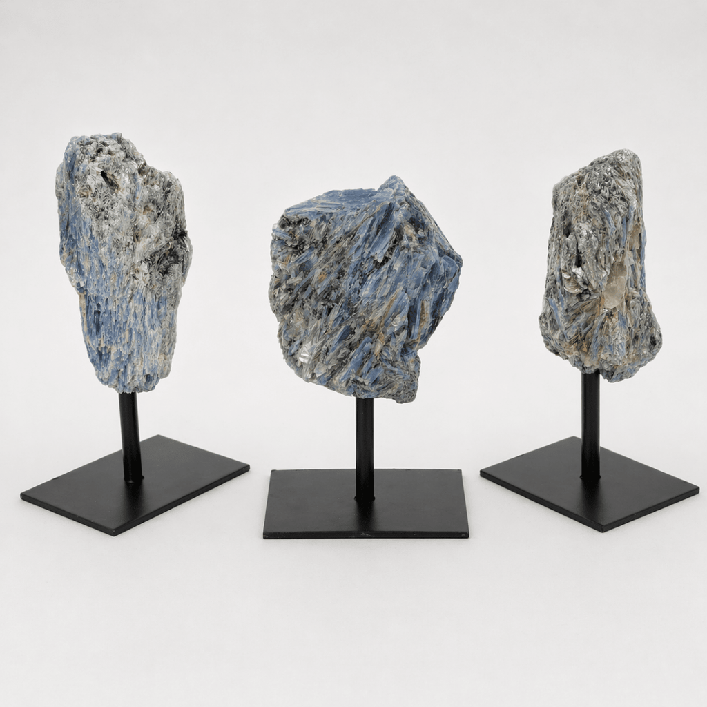 Rough blue kyanite specimen on a metal stand